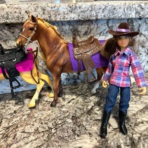 2 dolls 2 horses and horse blankets